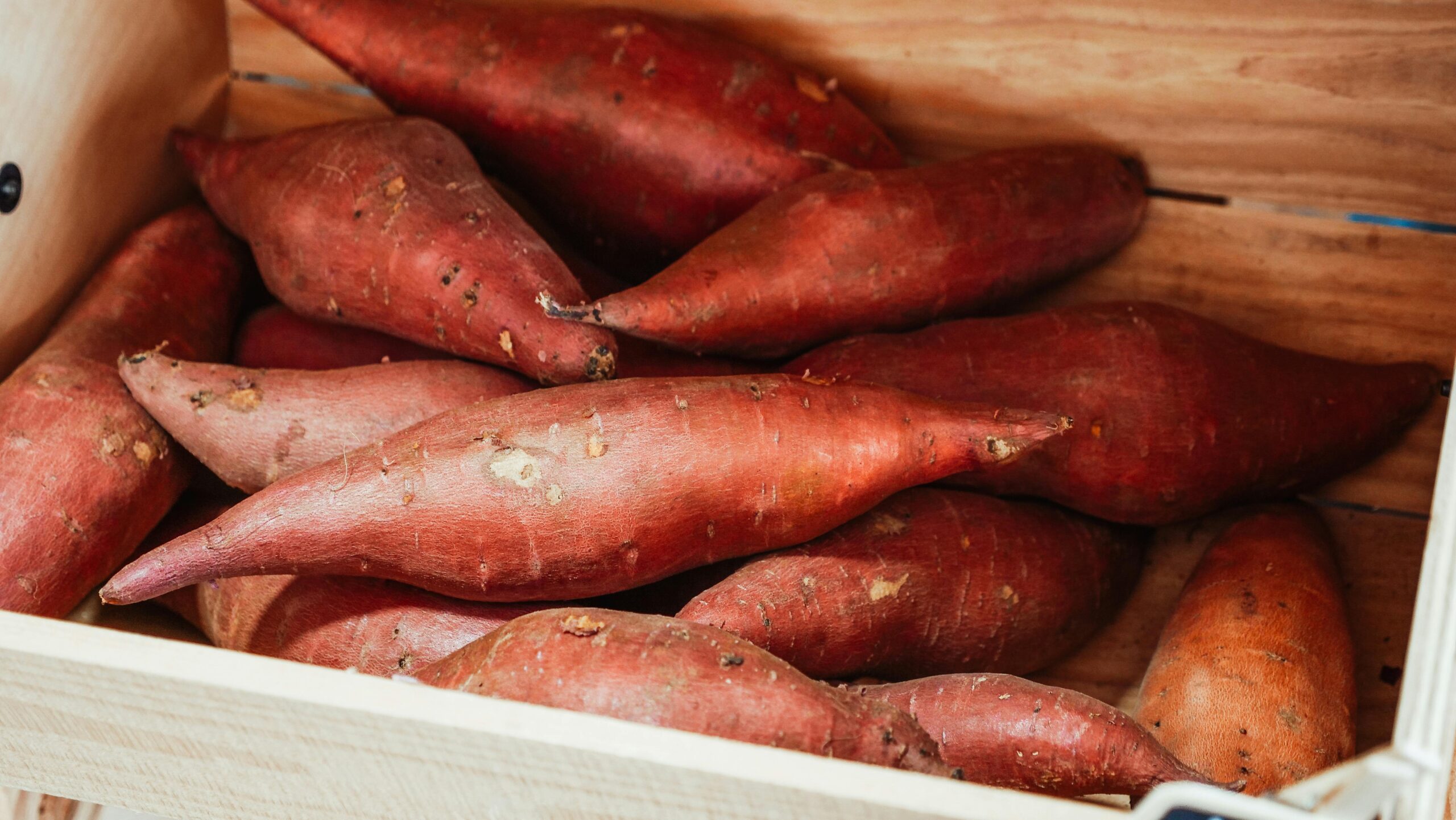 Box of sweet potatoes as a header picture.